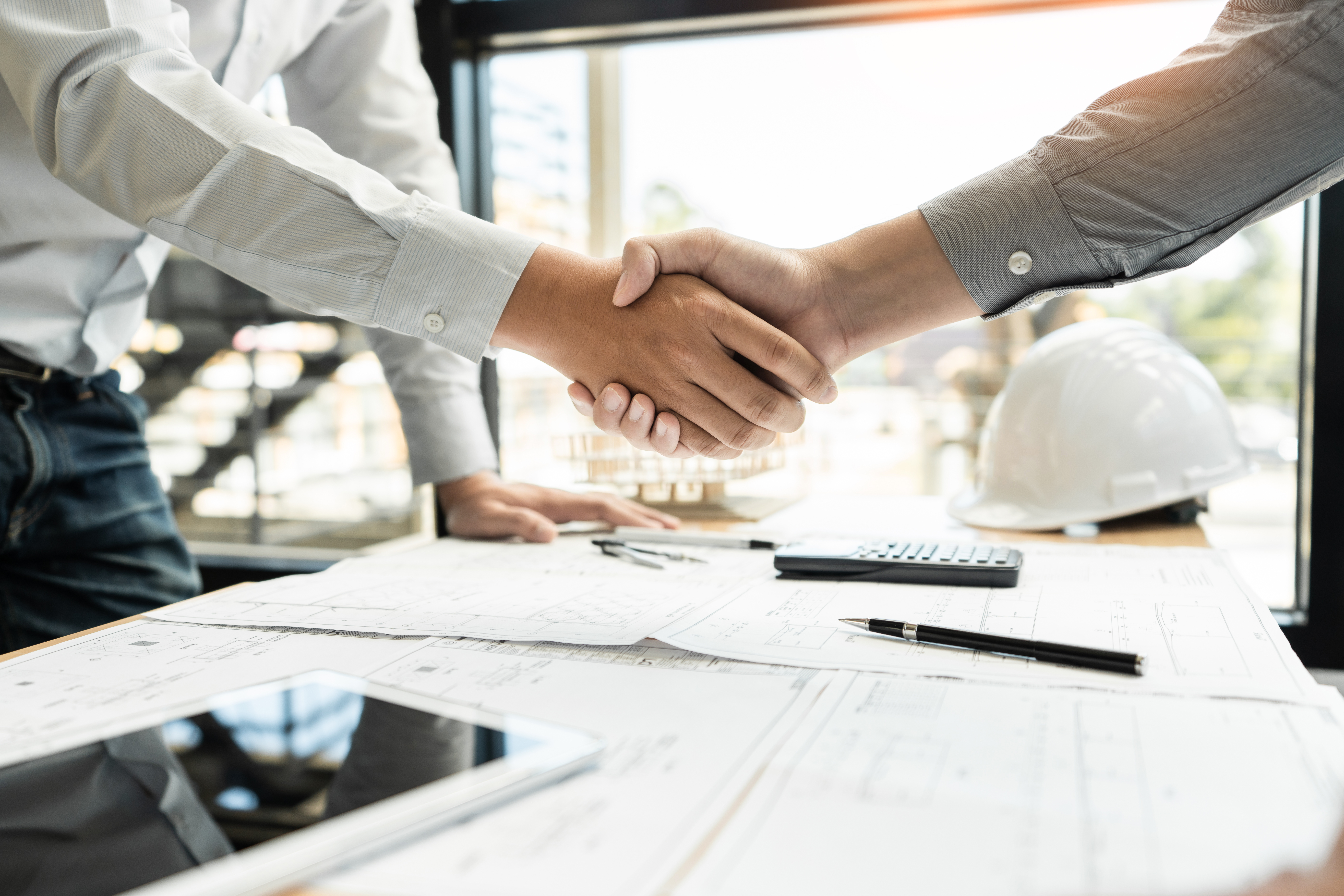 Handshake representing a supplier partnership agreement